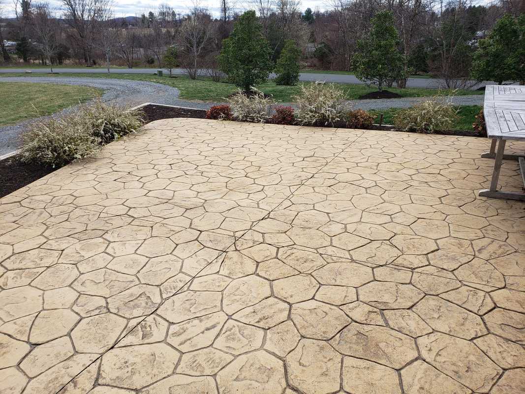 A stained concrete patio made of stamped concrete